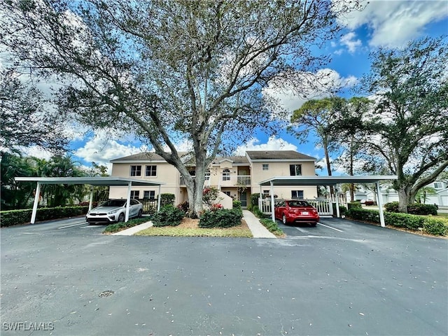 view of front of house featuring covered parking