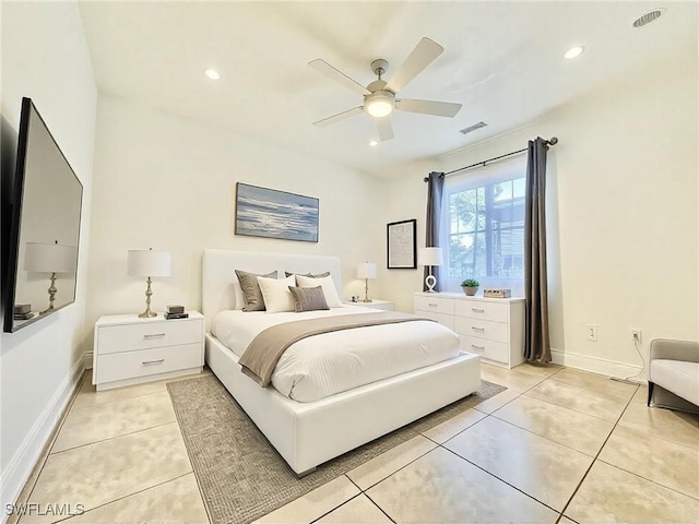 bedroom featuring light tile patterned floors, baseboards, visible vents, and recessed lighting