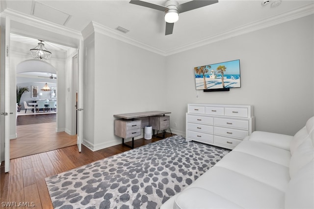 interior space featuring crown molding, ceiling fan with notable chandelier, and dark hardwood / wood-style floors