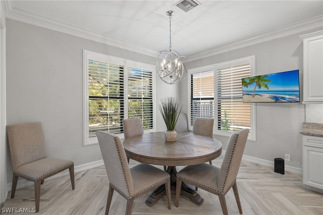 dining area with ornamental molding, a healthy amount of sunlight, and light parquet flooring