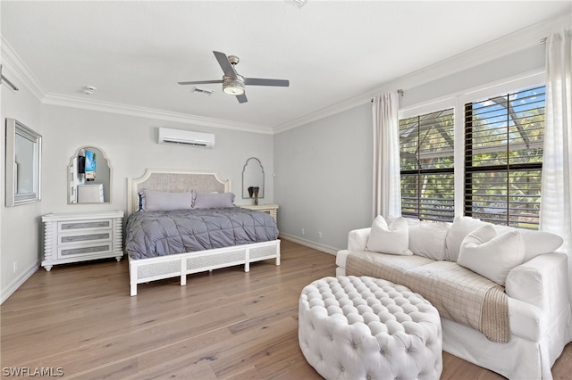 bedroom with ceiling fan, ornamental molding, wood-type flooring, and a wall unit AC