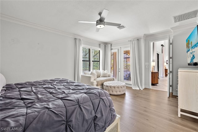 bedroom featuring access to outside, ceiling fan, light hardwood / wood-style floors, crown molding, and a textured ceiling