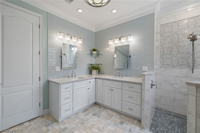 bathroom featuring tile walls, backsplash, vanity, tiled shower, and crown molding