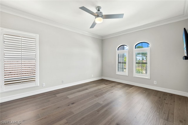 unfurnished room with crown molding, dark hardwood / wood-style floors, and ceiling fan