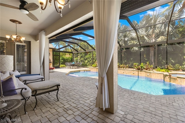 view of swimming pool with an in ground hot tub, ceiling fan, a lanai, and a patio