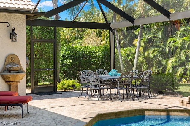 unfurnished sunroom with a patio area