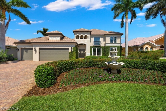 mediterranean / spanish-style home featuring a garage