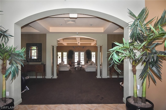 tiled foyer featuring beam ceiling, french doors, and coffered ceiling