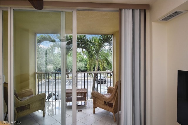 entryway featuring french doors, floor to ceiling windows, and light tile patterned flooring