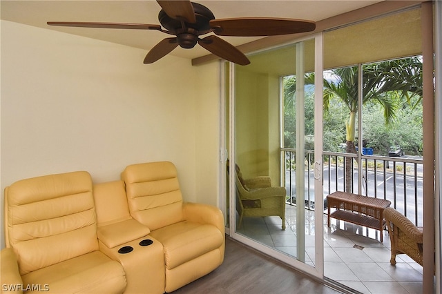 sitting room with hardwood / wood-style floors, ceiling fan, and a healthy amount of sunlight