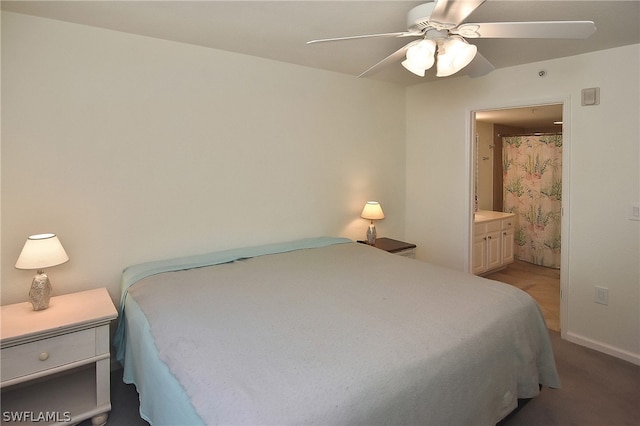 bedroom featuring ensuite bath and ceiling fan