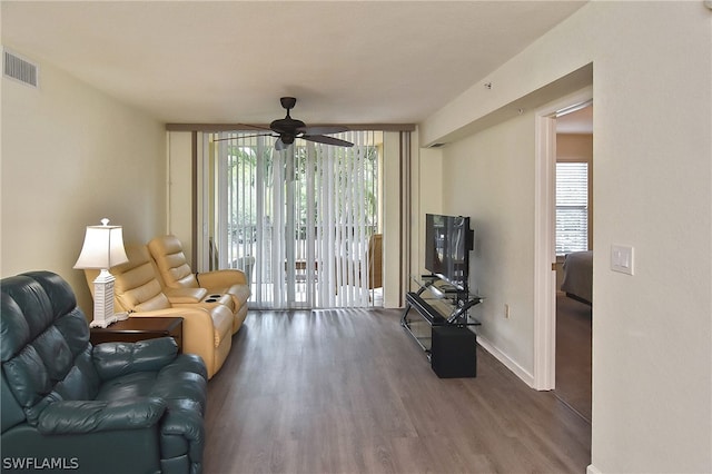 living room featuring wood-type flooring, french doors, and ceiling fan