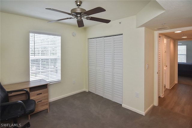 carpeted home office featuring a wealth of natural light and ceiling fan