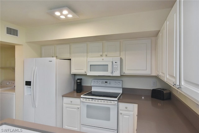 kitchen featuring washer / clothes dryer, white cabinets, and white appliances