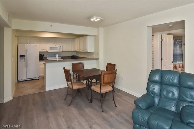 dining room with light wood-type flooring