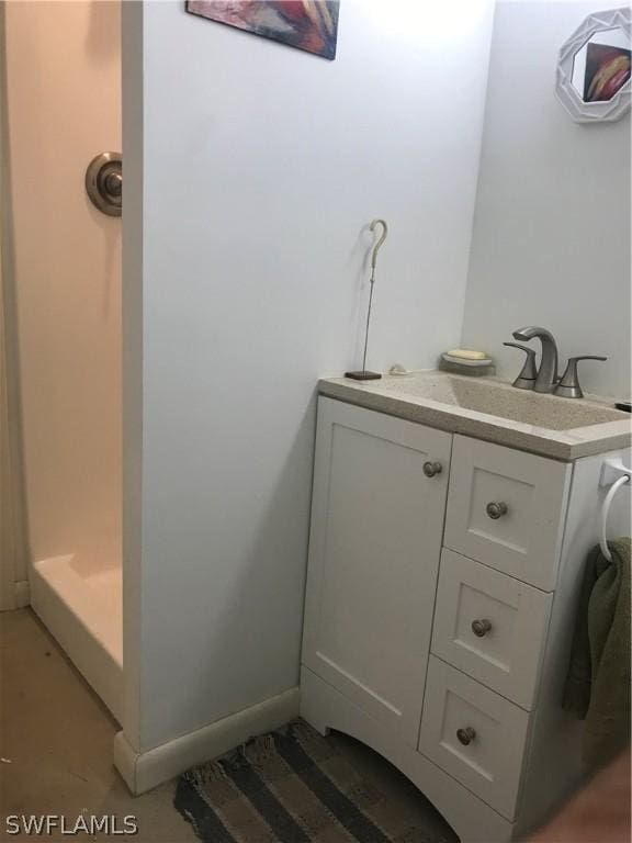 bathroom featuring vanity and walk in shower