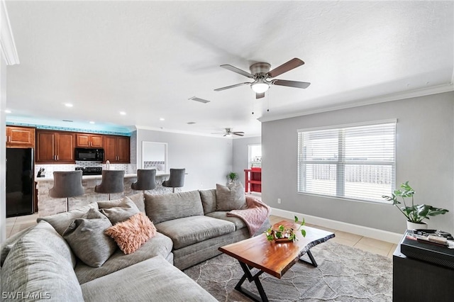 tiled living room featuring ceiling fan and crown molding