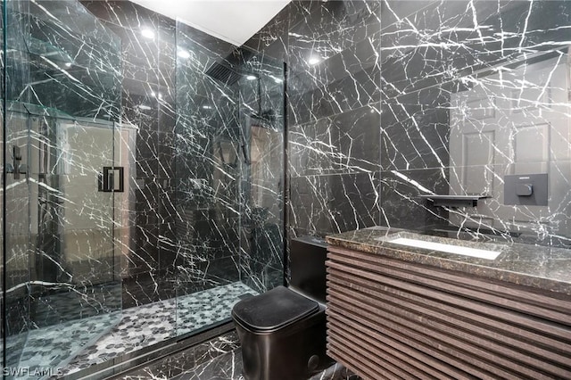 bathroom featuring tile walls, vanity, an enclosed shower, and toilet