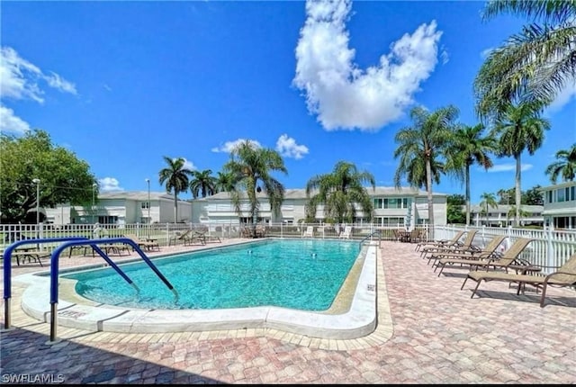 view of swimming pool with a patio area