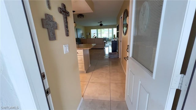 hallway featuring light tile patterned flooring