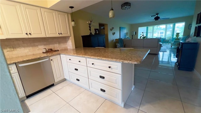 kitchen with dishwasher, white cabinetry, light tile patterned flooring, decorative light fixtures, and kitchen peninsula