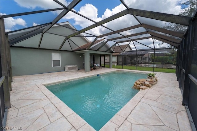 view of pool featuring a lanai and a patio area