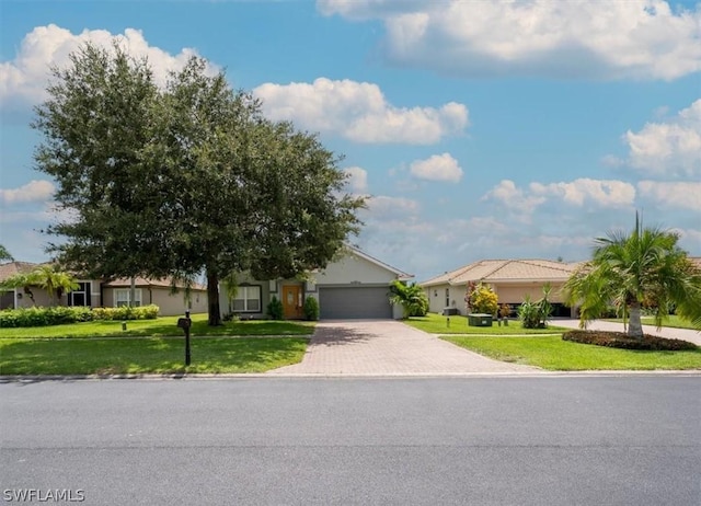 view of front of property featuring a garage and a front lawn