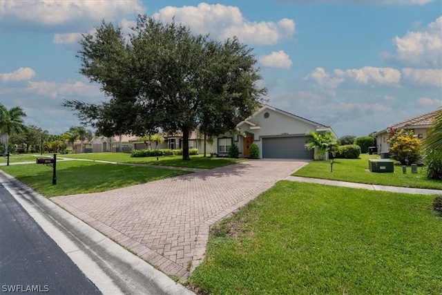 view of front of home featuring a garage and a front yard