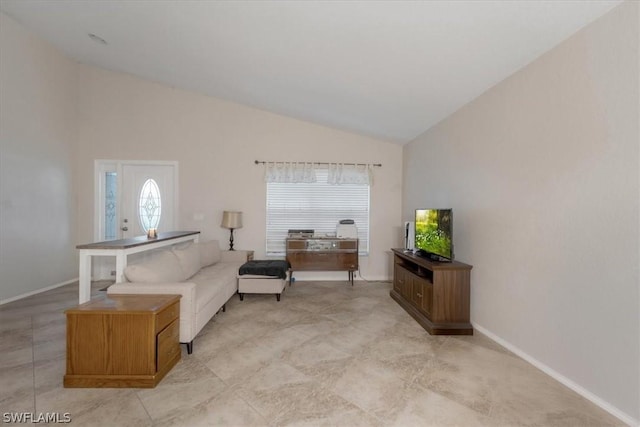 sitting room with high vaulted ceiling