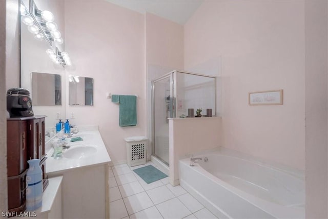 bathroom with tile patterned flooring, vanity, and separate shower and tub