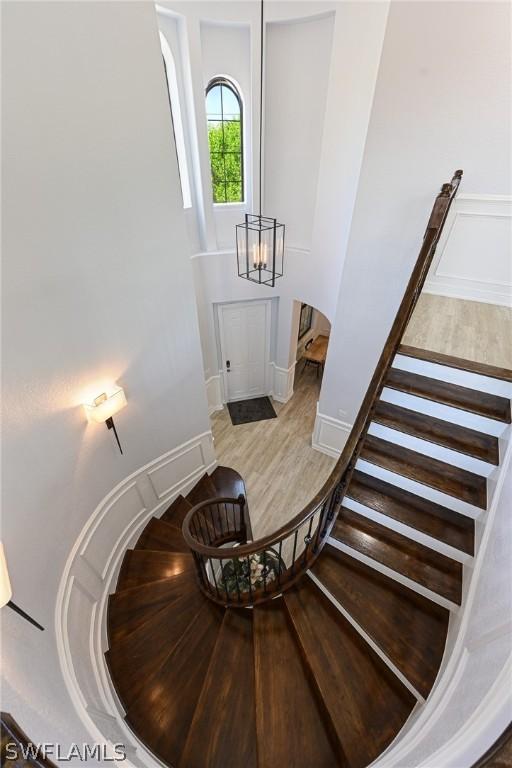 staircase featuring hardwood / wood-style flooring