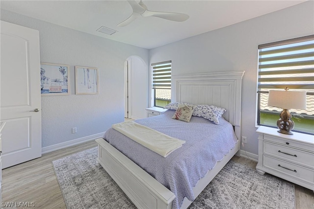 bedroom with ceiling fan and light wood-type flooring