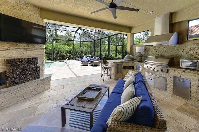 view of patio featuring an outdoor kitchen, a lanai, an outdoor living space, ceiling fan, and grilling area