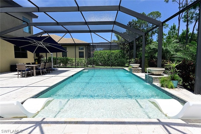 view of pool featuring a patio and a lanai