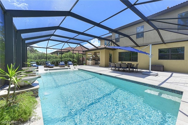 view of pool featuring a patio and glass enclosure