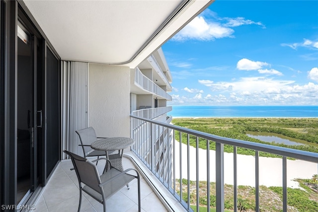 balcony featuring a water view