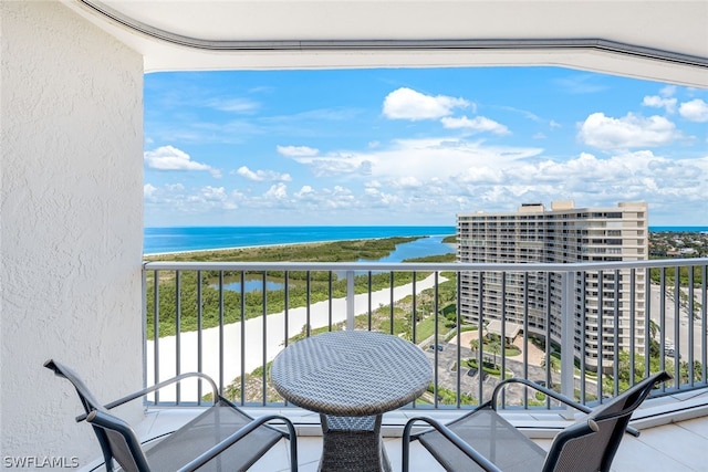 balcony featuring a water view