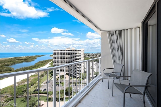 balcony featuring a water view