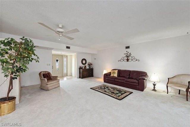 living room featuring light carpet and ceiling fan