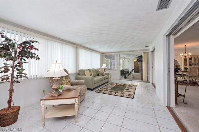 sunroom with a notable chandelier