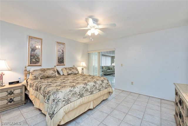 bedroom with ceiling fan and light tile patterned floors