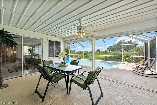 sunroom / solarium featuring ceiling fan and plenty of natural light