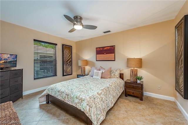 tiled bedroom featuring ceiling fan