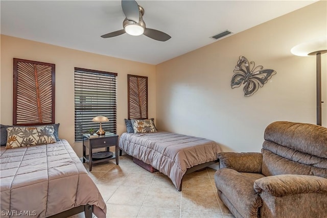 tiled bedroom with ceiling fan