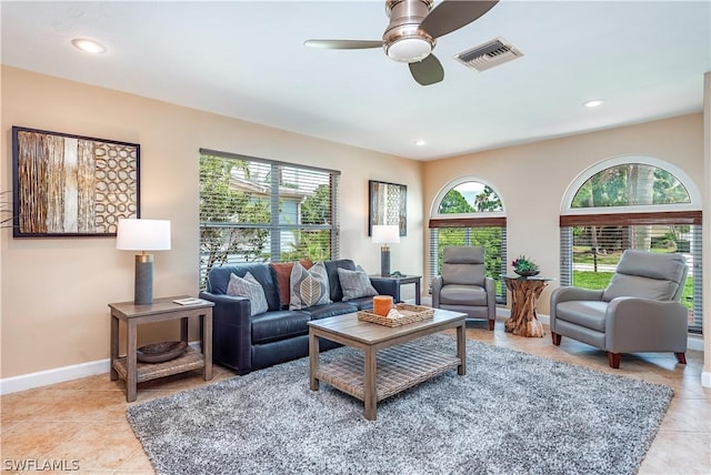 tiled living room featuring ceiling fan