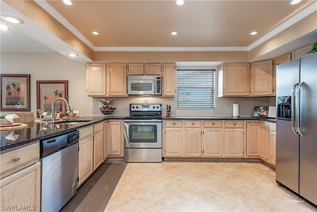 kitchen featuring light brown cabinets, light tile patterned floors, and appliances with stainless steel finishes