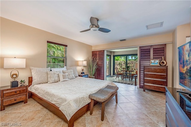 bedroom with light tile patterned floors and ceiling fan