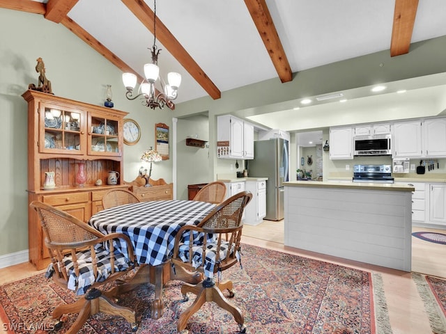 dining space with a chandelier, light wood-type flooring, and vaulted ceiling with beams