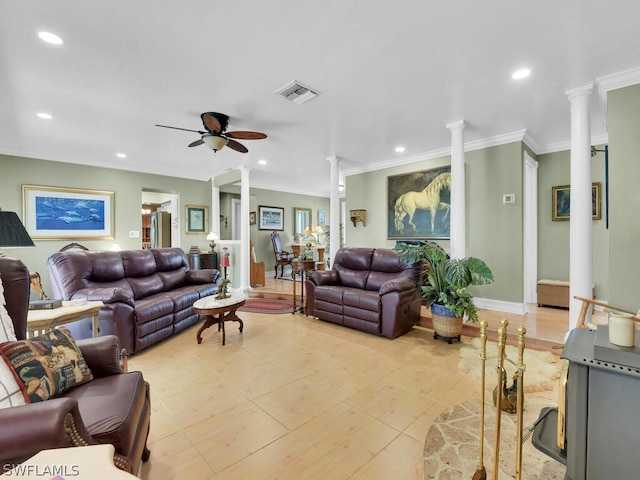 living room featuring ceiling fan, ornamental molding, and decorative columns