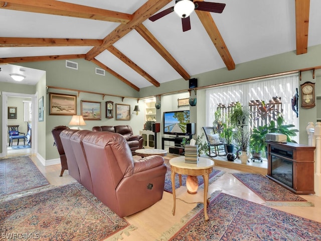 living room with beam ceiling, ceiling fan, and high vaulted ceiling